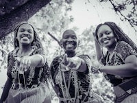 three african women posing for a photo